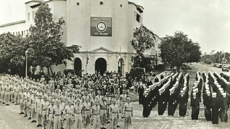 Military students stand in formation in front of the Anastasia Building, 1943.