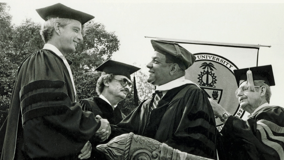 President Tad Foote, left, oversees commencement ceremonies.