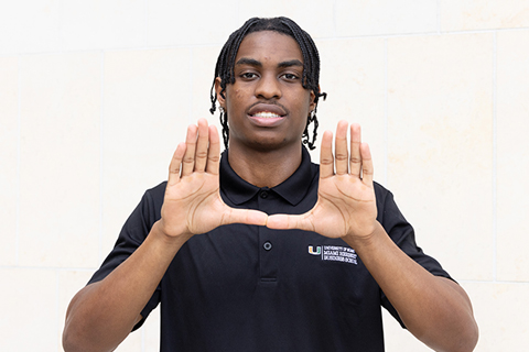 Brian Bros throwing up the U