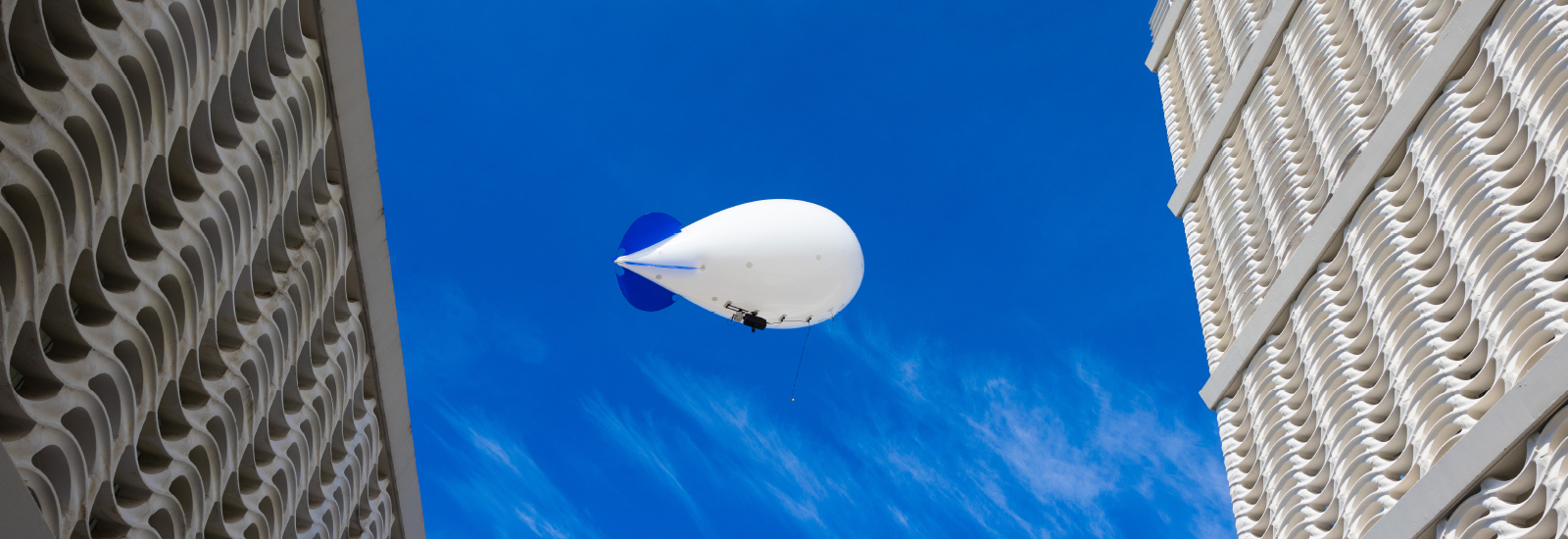 A smart balloon collects aerosol data at 200 feet of elevation over the McArthur Engineering Building.