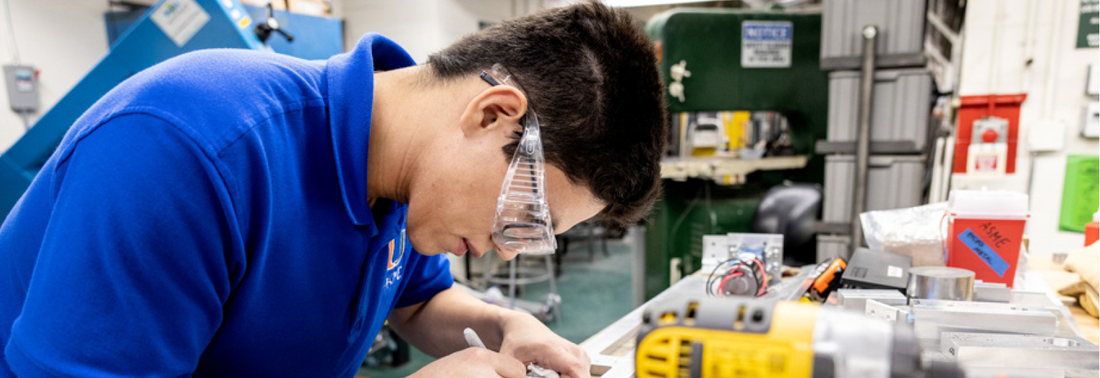 Neyton Baltodano Jr., a senior in the College of Engineering, is whose mission is to testing the strength of short carbon fibers.